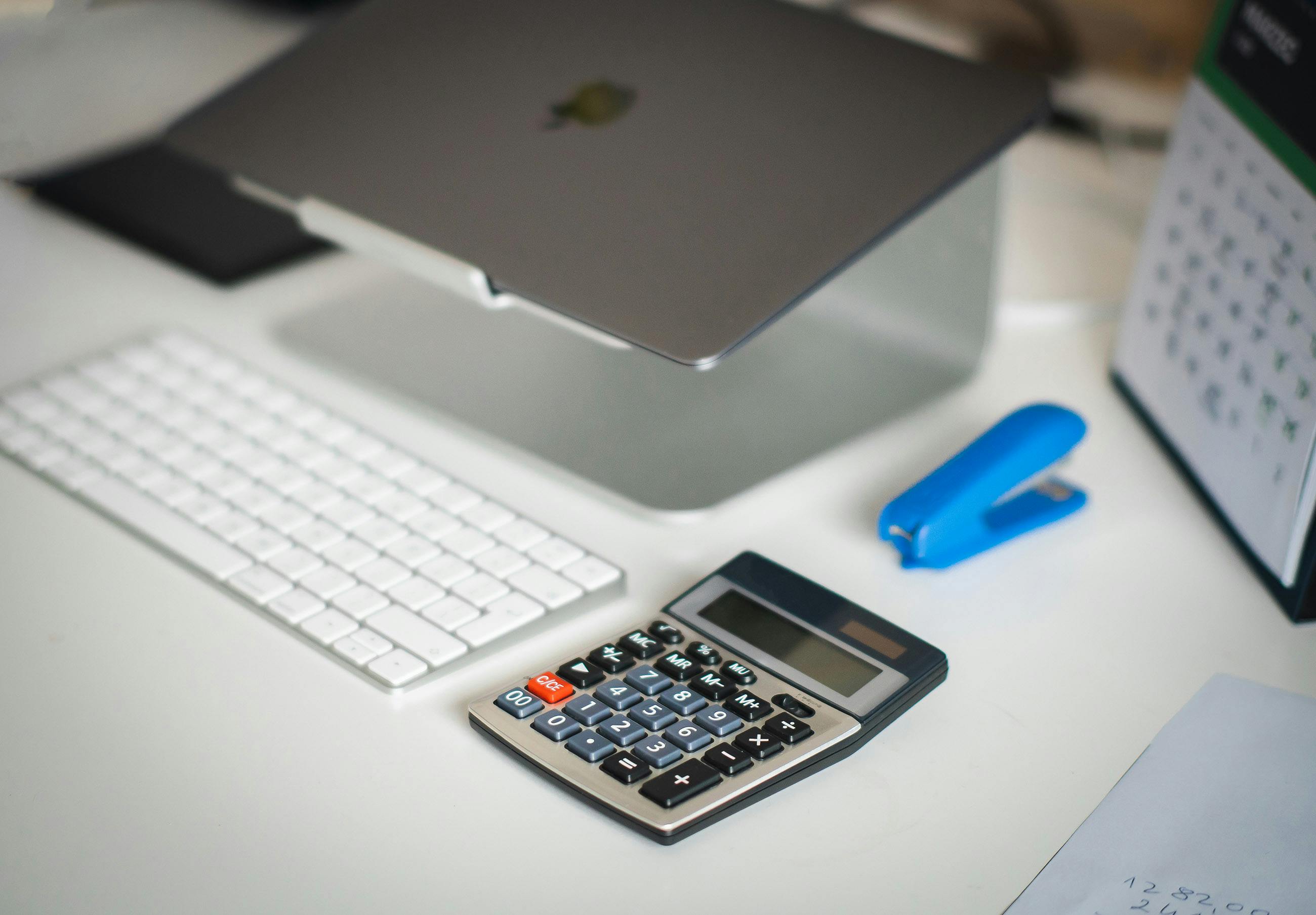 Medical billing office desk with laptop and documentation